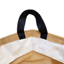 Close-up of a beige bag with a black strap on a white background