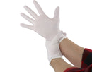 White gloves being worn on a white background