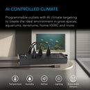 AI-controlled climate control system with outlets on a table, aquarium in the background.
