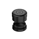 Black cylindrical container with a floral design on a white background