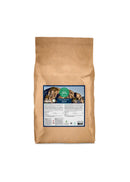 Brown paper bag with a label featuring mountain scenery on a white background